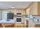 Well-lit kitchen with a center island, modern appliances, and ample counter space at 5319 Memory Ln, Durham, NC 27712