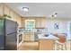 Inviting kitchen featuring wood cabinets, neutral countertops, stainless steel appliances, and a cozy breakfast nook at 5319 Memory Ln, Durham, NC 27712