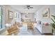 Cozy living room with natural light, modern furniture, and an open layout leading to the dining area at 5319 Memory Ln, Durham, NC 27712