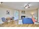 Inviting living room with a brick fireplace, a cozy sofa, and natural light filtering through the windows at 5319 Memory Ln, Durham, NC 27712