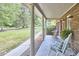 The outdoor porch offers an inviting spot to relax and appreciate the charm of the neighborhood at 5319 Memory Ln, Durham, NC 27712