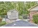 Well-maintained storage shed near the home, offering secure space for tools and equipment at 5319 Memory Ln, Durham, NC 27712