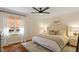 Serene bedroom with soft lighting, hardwood floors, and a comfortable bed at 5709 Lakehaven Dr, Raleigh, NC 27612