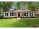 Charming single-story home with a well-manicured lawn and inviting curb appeal at 5709 Lakehaven Dr, Raleigh, NC 27612