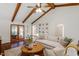 Bright living room featuring comfortable seating, wood floors, and access to the outdoors at 5709 Lakehaven Dr, Raleigh, NC 27612
