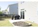 Backyard with flower garden, patio, and barbecue grills at 621 Childsberg Way, Hillsborough, NC 27278
