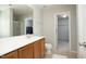 Bathroom features a vanity with wooden cabinets, mirror, and shower with walk in closet at 621 Childsberg Way, Hillsborough, NC 27278