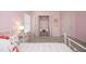 Pink bedroom featuring a desk area, closet, and view of the bed at 621 Childsberg Way, Hillsborough, NC 27278