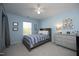 Blue bedroom with a ceiling fan, a window, a bed, and a dresser at 621 Childsberg Way, Hillsborough, NC 27278