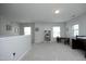 Versatile bonus room with neutral carpet, a small desk, and a bookshelf, perfect for a home office or play area at 621 Childsberg Way, Hillsborough, NC 27278
