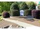 Kenton Grove community entrance sign with landscaping, walkway, and bench at 621 Childsberg Way, Hillsborough, NC 27278