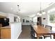 Open-concept dining area with seamless flow into kitchen and living areas at 621 Childsberg Way, Hillsborough, NC 27278