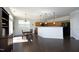 Eat-in kitchen with modern appliances, pendant lighting, and hardwood floors throughout at 621 Childsberg Way, Hillsborough, NC 27278