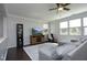 Comfortable living room featuring lots of natural light, plush seating, and a ceiling fan at 621 Childsberg Way, Hillsborough, NC 27278