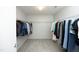 Spacious walk-in closet with ample hanging space and neutral carpet at 621 Childsberg Way, Hillsborough, NC 27278