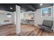 Finished basement with laminate floors, modern furniture, and ample natural light at 623 Massey Ave, Durham, NC 27701