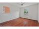 Bedroom with hardwood floors, ceiling fan, and two windows for natural light at 623 Massey Ave, Durham, NC 27701