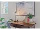 Close-up of the desk area with a modern lamp, books, and potted plant at 623 Massey Ave, Durham, NC 27701