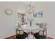 Bright breakfast nook features a built-in bench, modern chandelier, and natural light at 623 Massey Ave, Durham, NC 27701