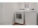Laundry area showcasing a modern washer and dryer set against white walls at 623 Massey Ave, Durham, NC 27701