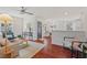 Open-concept living room featuring hardwood floors, neutral decor, and a cozy seating area at 623 Massey Ave, Durham, NC 27701