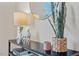 Tastefully decorated console table with a lamp, decorative horses and round mirror at 623 Massey Ave, Durham, NC 27701