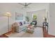 Bright living room showcasing a modern sofa, hardwood floors, and plenty of natural light at 623 Massey Ave, Durham, NC 27701