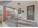 This cozy front porch features a bistro set, a decorative front door, and a 'hello' door mat at 623 Massey Ave, Durham, NC 27701
