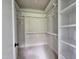 Walk-in closet with built-in shelves and hanging rods for ample storage and organization at 629 Conover Rd, Durham, NC 27703