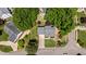 Aerial view of a residential property showcasing the roof, landscaping, and surrounding trees at 6509 Virgilia Ct, Raleigh, NC 27616