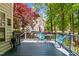 Back deck with seating and view of foliage at 6509 Virgilia Ct, Raleigh, NC 27616