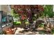 Backyard patio with an outdoor dining set and shade trees at 6509 Virgilia Ct, Raleigh, NC 27616