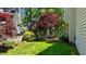 Well-maintained backyard featuring a patio area and vibrant foliage, perfect for outdoor enjoyment at 6509 Virgilia Ct, Raleigh, NC 27616