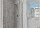Bathroom with a large glass shower, marble backsplash, and modern fixtures at 6509 Virgilia Ct, Raleigh, NC 27616