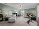Spacious bedroom with neutral carpet, ceiling fan, a lounger and exercise bike at 6509 Virgilia Ct, Raleigh, NC 27616