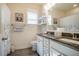 Inviting bathroom features double sinks, granite countertop, and modern fixtures at 67 Crimson Way, Pittsboro, NC 27312