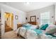 Comfortable bedroom with a bed and wooden dresser at 67 Crimson Way, Pittsboro, NC 27312