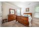Cozy bedroom featuring a wooden dresser and decor at 67 Crimson Way, Pittsboro, NC 27312