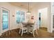 Breakfast nook with a round table and white chairs with natural lighting at 67 Crimson Way, Pittsboro, NC 27312