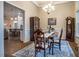 Formal dining room with chandelier and large windows at 67 Crimson Way, Pittsboro, NC 27312