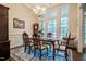 Formal dining room with chandelier and large windows at 67 Crimson Way, Pittsboro, NC 27312