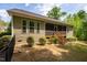 Home exterior featuring a screened in porch at 67 Crimson Way, Pittsboro, NC 27312