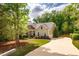 An exterior view of the house with a long, paved driveway at 67 Crimson Way, Pittsboro, NC 27312