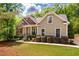 A lovely home with a well-manicured lawn and inviting front porch at 67 Crimson Way, Pittsboro, NC 27312
