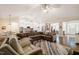 Spacious living room featuring an open layout with breakfast nook and stainless steel appliances at 67 Crimson Way, Pittsboro, NC 27312