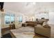 Spacious living room with a large sectional and natural light at 67 Crimson Way, Pittsboro, NC 27312
