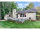 Back of house features a deck and well maintained lawn at 6820 Chamonix Pl, Raleigh, NC 27613