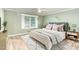 A serene bedroom offering a ceiling fan, and neutral decor with natural light at 6820 Chamonix Pl, Raleigh, NC 27613