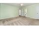 Spacious bedroom with an ensuite bathroom and an interior door at 6820 Chamonix Pl, Raleigh, NC 27613