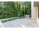Spacious wooden deck perfect for outdoor entertaining, surrounded by lush greenery at 6820 Chamonix Pl, Raleigh, NC 27613
